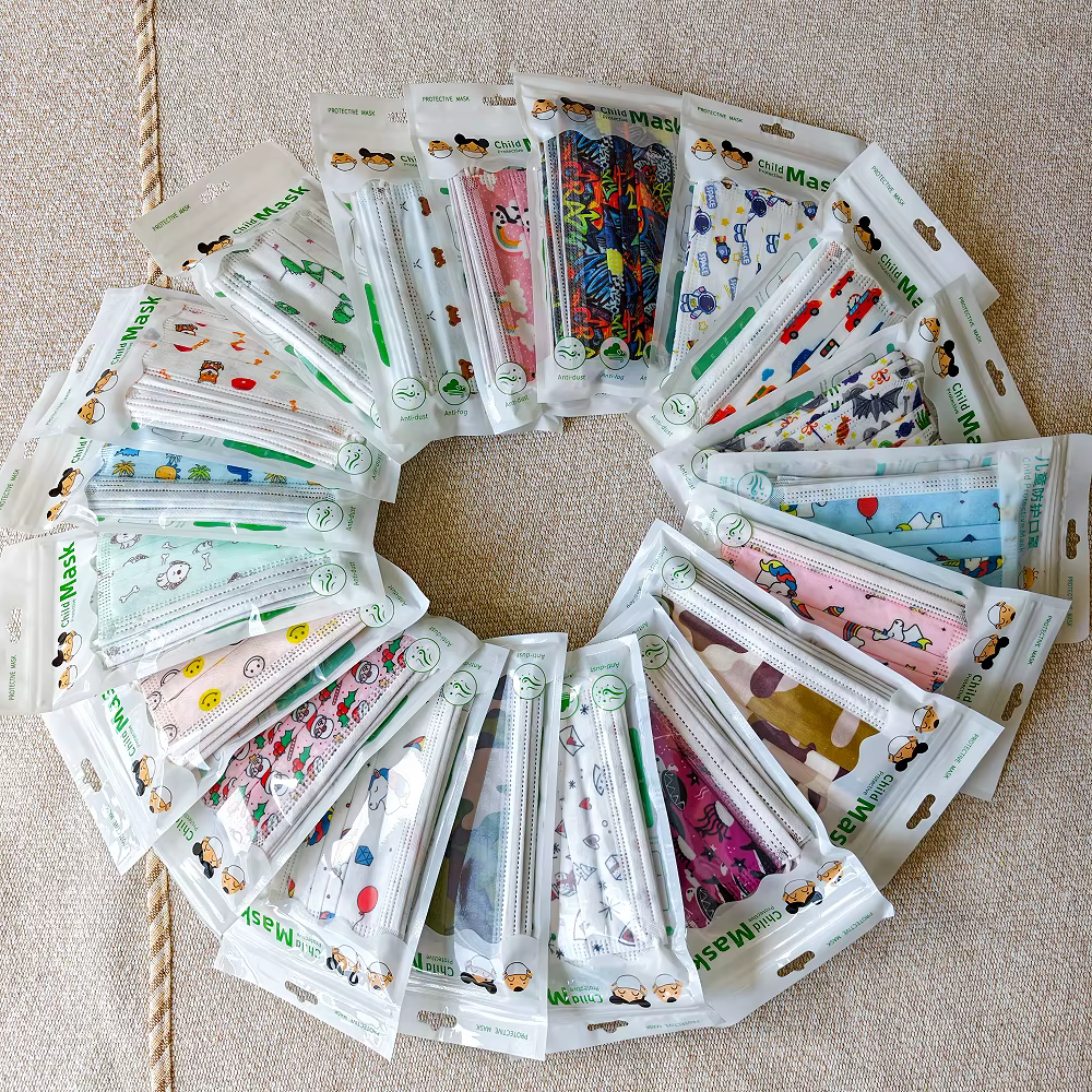 Masque facial jetable pour enfants, 50/100 pièces, imprimés de dessins animés mignons, 3 couches, protection anti-poussière, cadeau pour garçons et filles de 3 à 12 ans