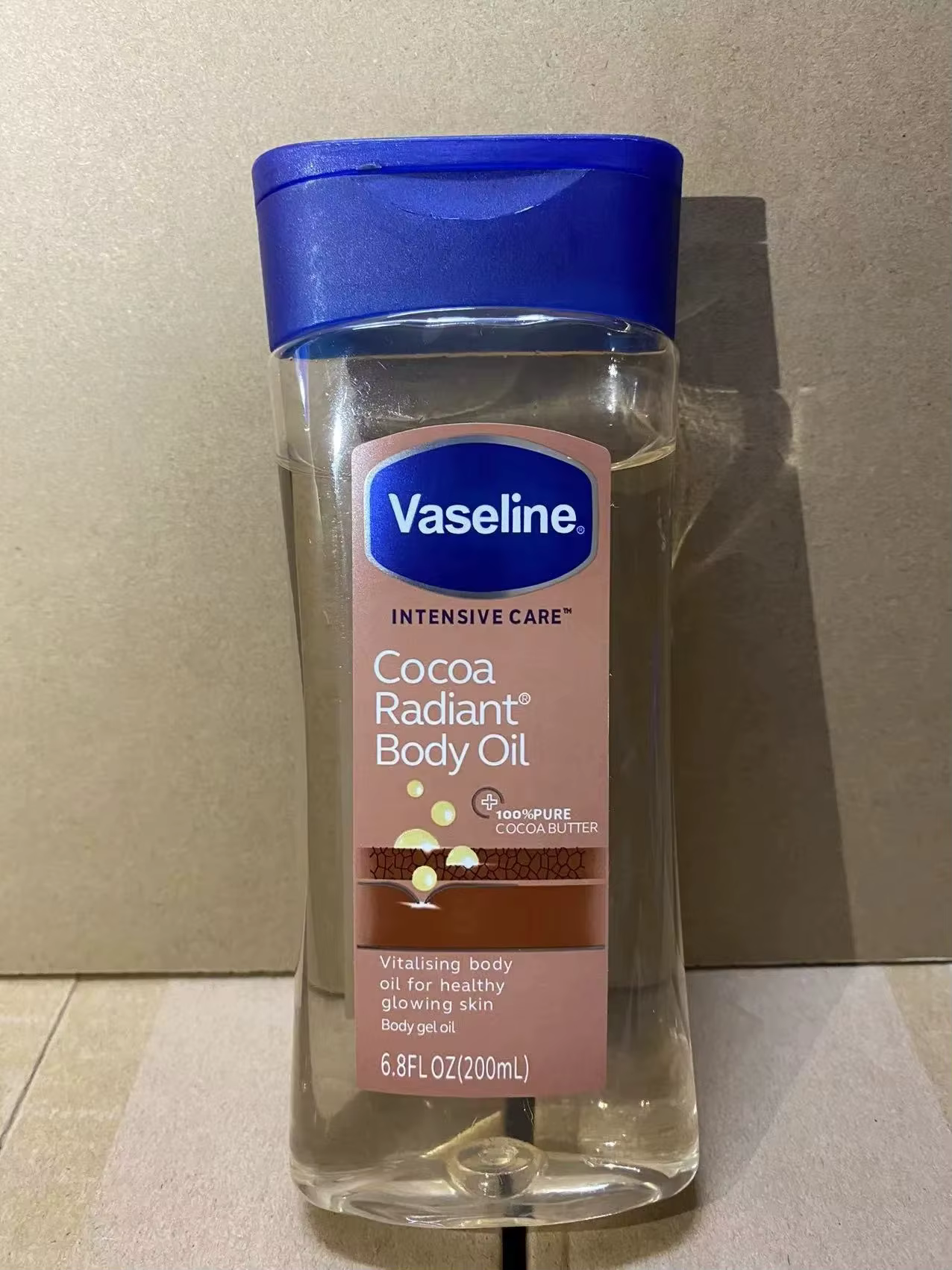 Huile Corporelle Éclatante au Cacao Vaseline 200ml – Soin Hydratant Longue Durée